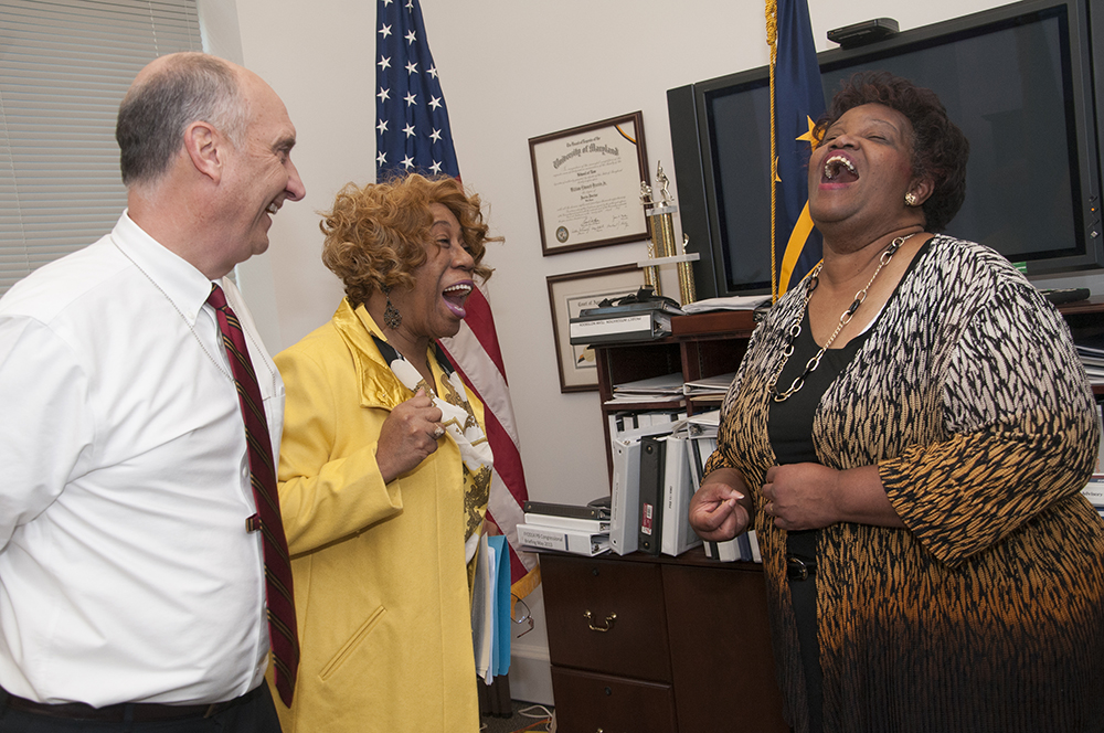 William Brazis laughs with WHS emloyees