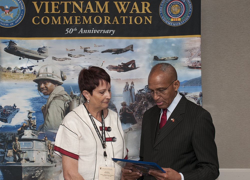 MG Arnold Fields presents a certificate on behalf of the United States of American Vietnam War Commemoration at the National League of Families 46th Annual Meeting
