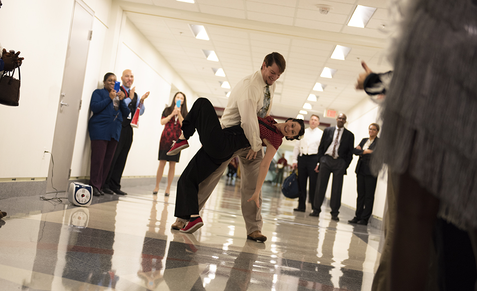 Two swing dancers finish up a routine for WHS employees