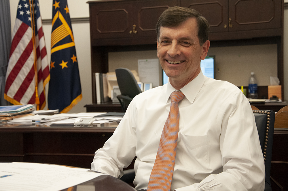 Middle aged man posing for an article picture