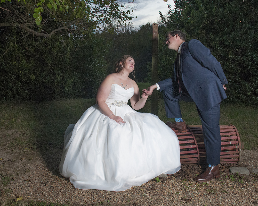 Newly wedded couple posing for a picture