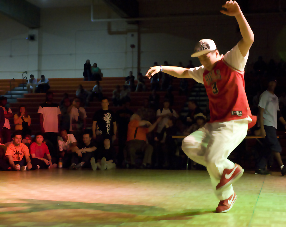 Young male breakdancing in a college competition